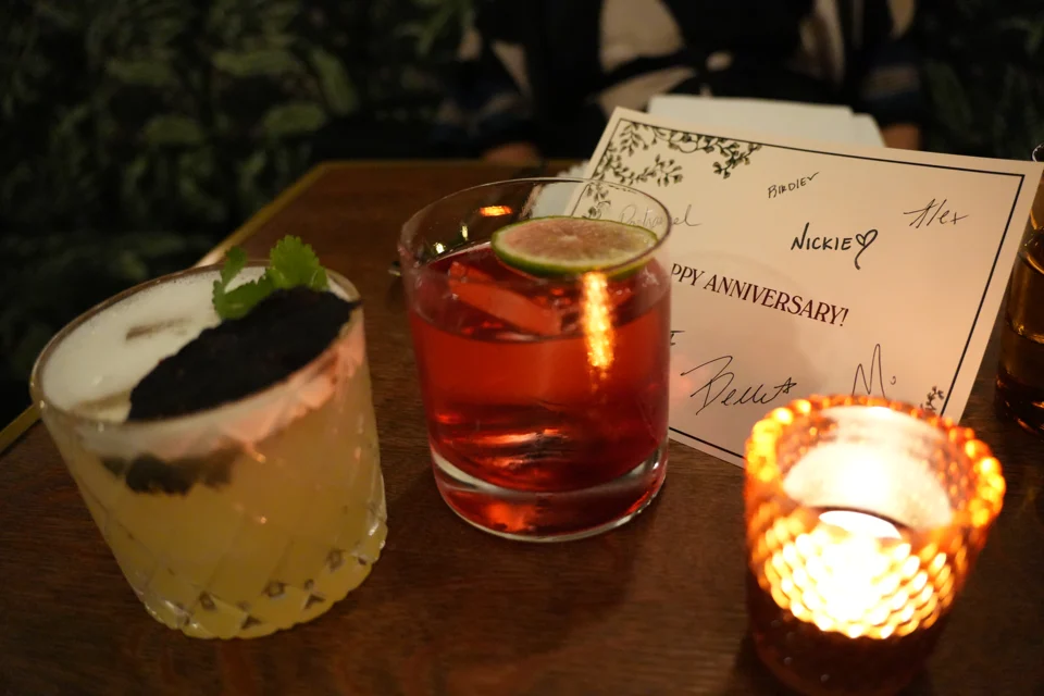 Our anniversary card, drinks, and candlelight