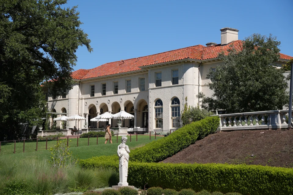 The mansion, framed by its formal gardens