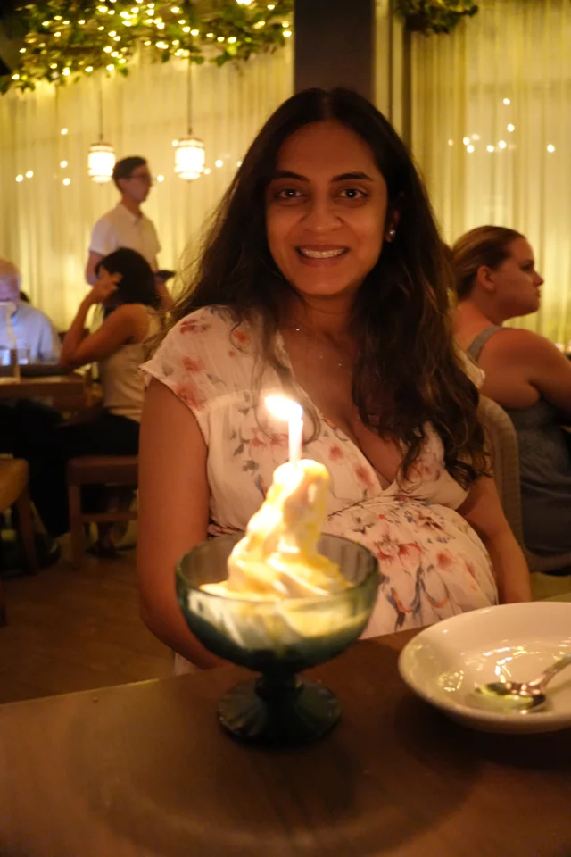 Mital with a candlelit dessert at Aba