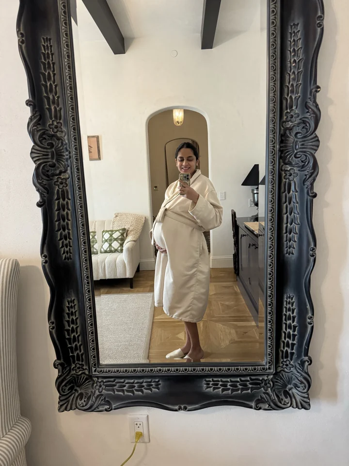 Mital’s massage afternoon, in a robe by the ornate mirror