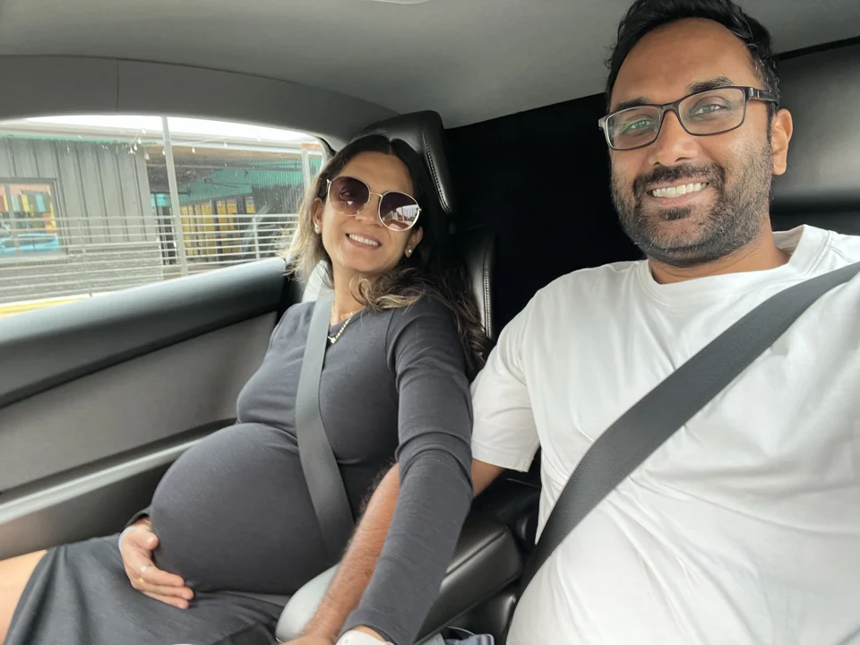 Sagar and Mital together on the way to the babymoon by cybercab